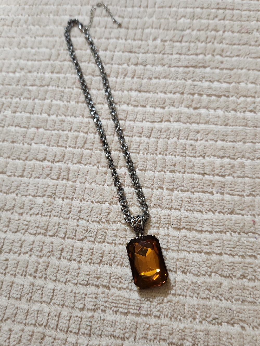 $3.00 WITH THE PURCHASE OF ANY PIECE.mber Brown Pendant Necklace Like New